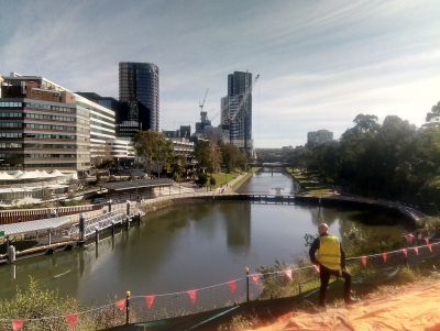 man looking towards parramatta river and ferry wharf from escarpment lookout site