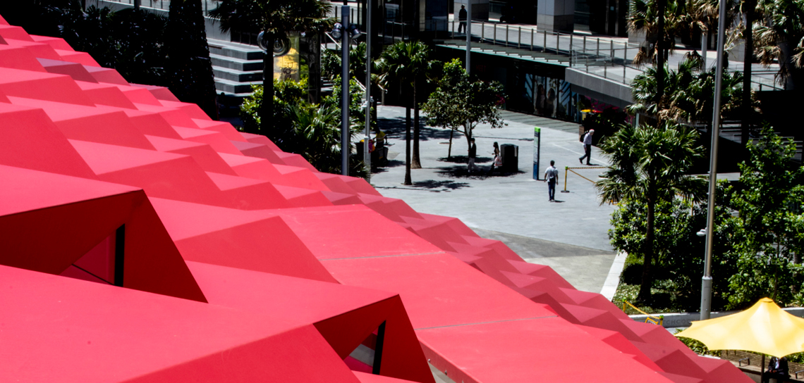 Close up image of the red roof looking down onto the street below