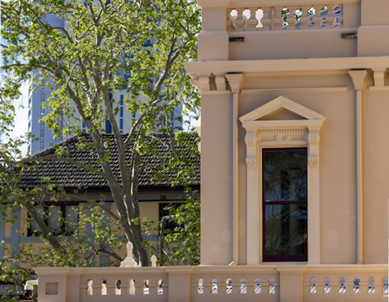 Close up image of one of the town hall's original balconies with window