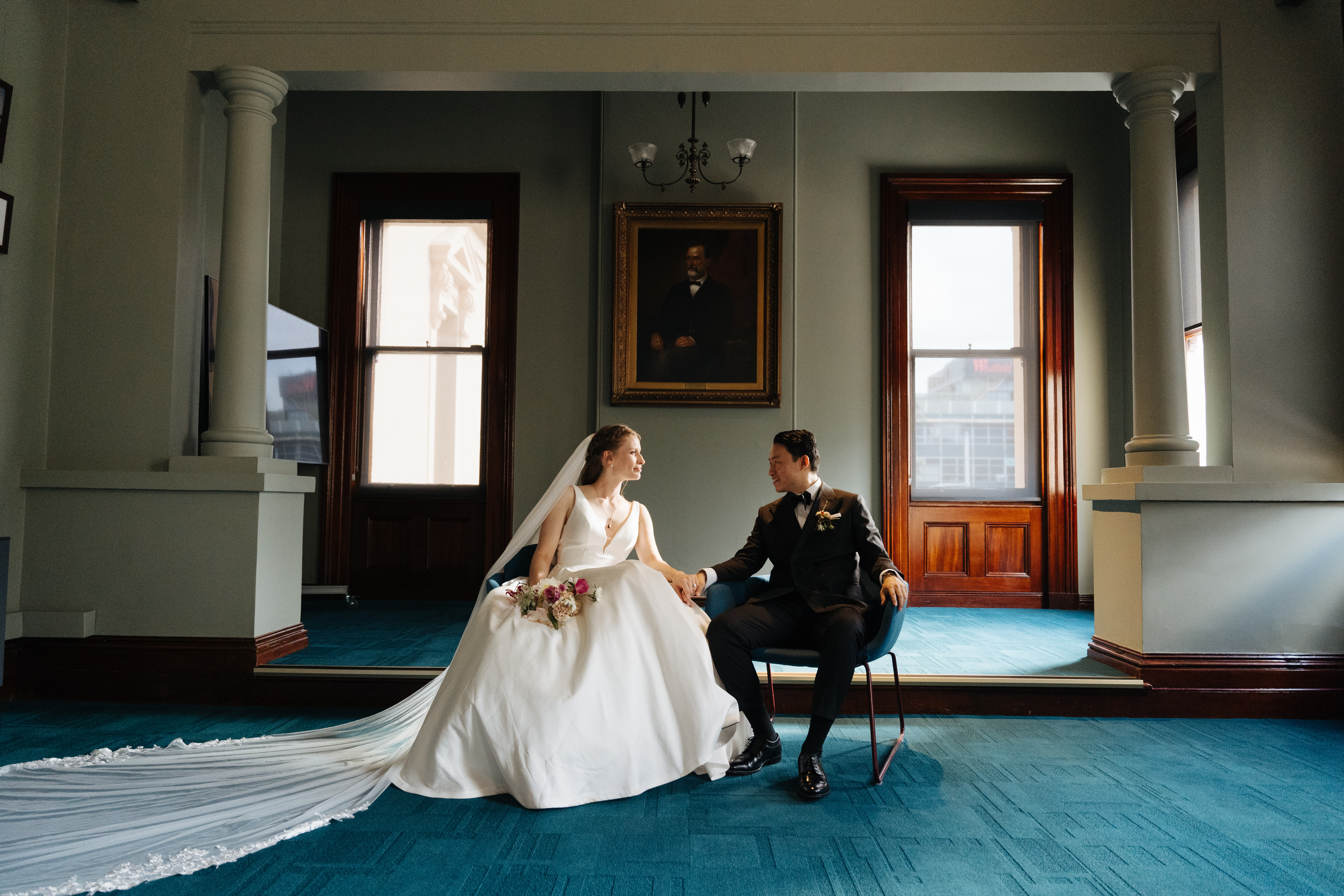 Bride and groom sitting in the Victorian inspired venue