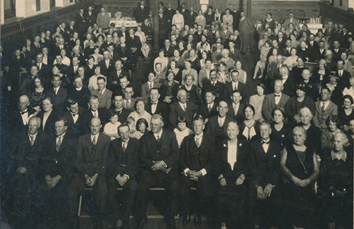 Room full of people attending a function at the town hall