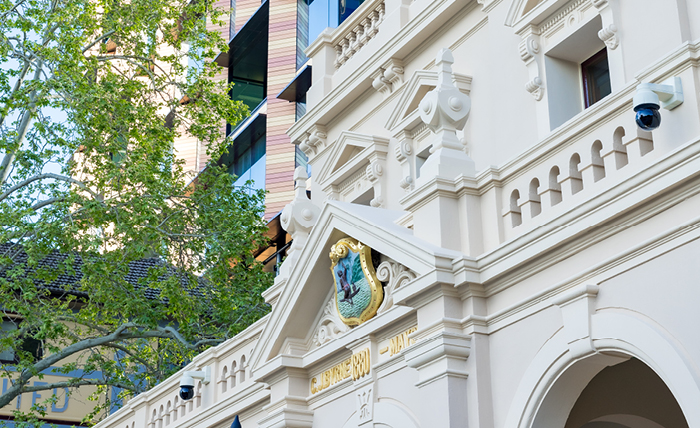 close up of the town hall's exterior with tree branches off to the side