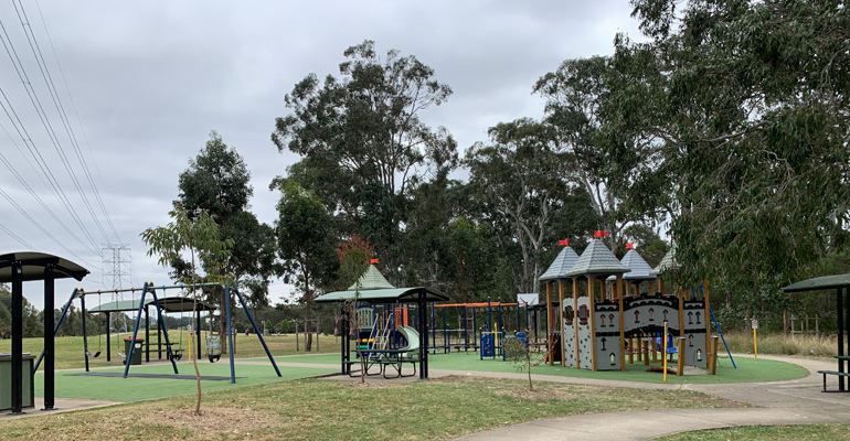 Swings, picnic tables, castle style play equipment