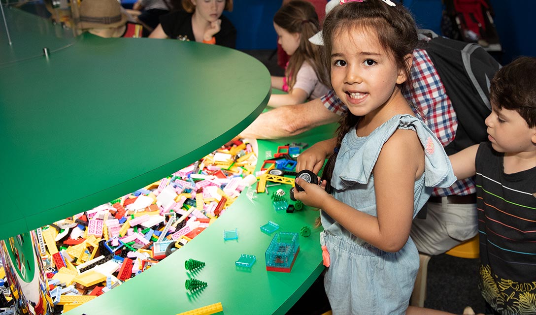 Girl playing with Lego