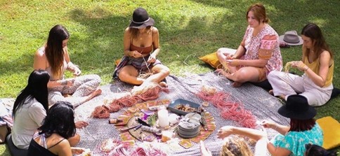 Women weaving as part of the Warami festival.