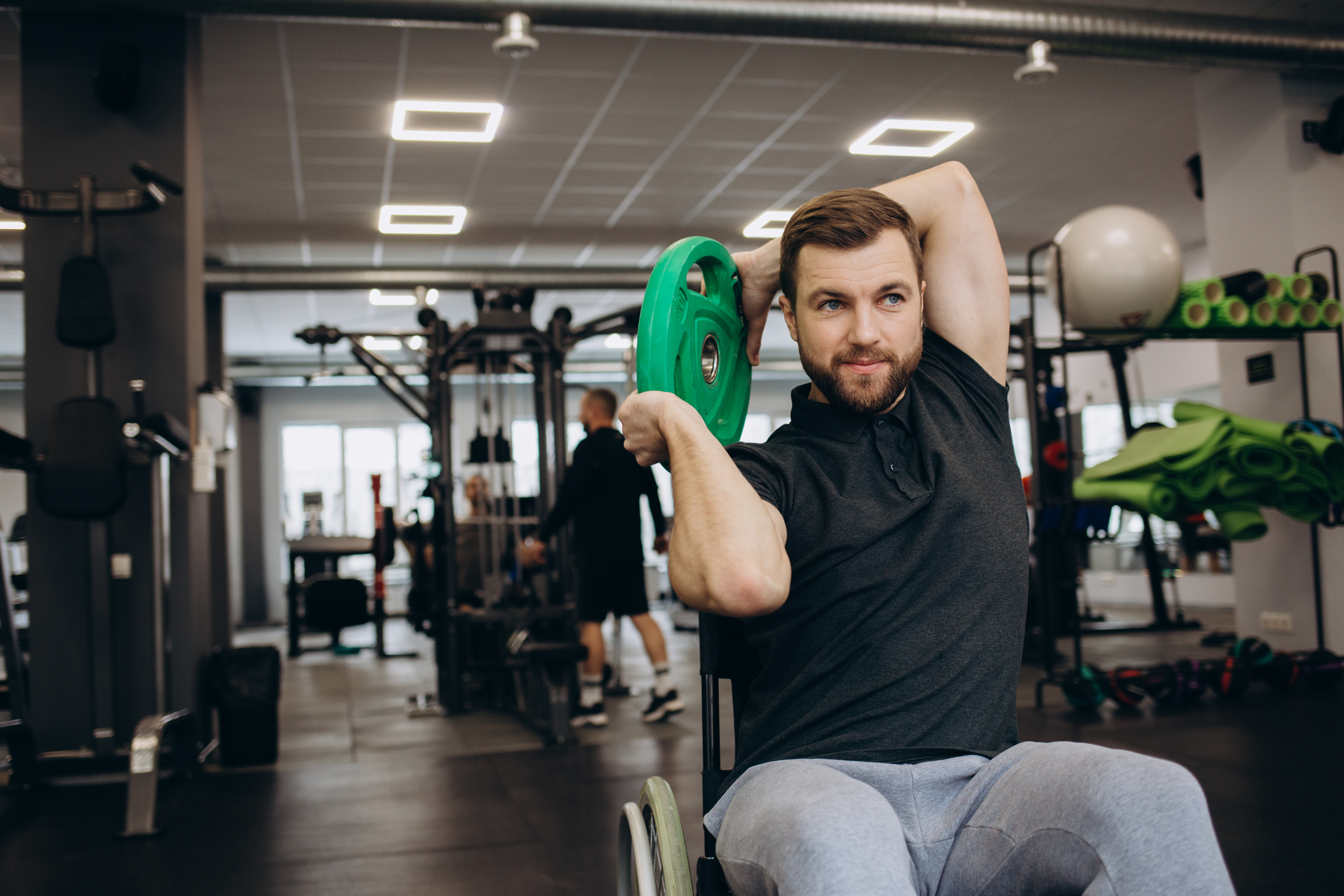 Image of man in wheelchair using the gym 