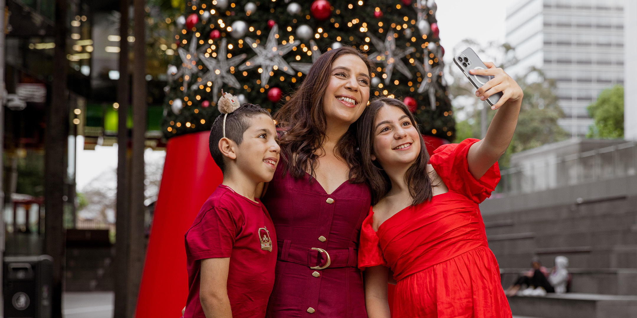 Mum and kids taking a Christmas picture