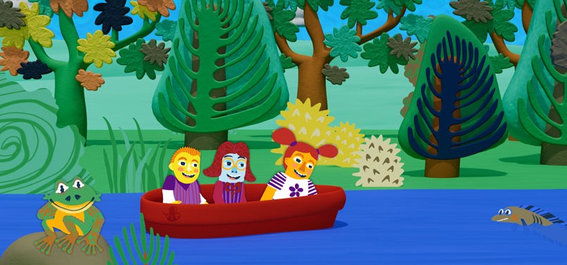 Colorful cartoon scene showing three animated characters in a red boat on a blue river, surrounded by lush, stylized trees. A frog sits smiling on a rock, while a fish peeks above the water. The mood is cheerful and vibrant.