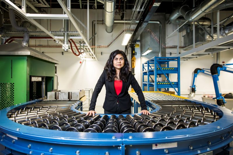 Professor Sahajwalla in front of machinery