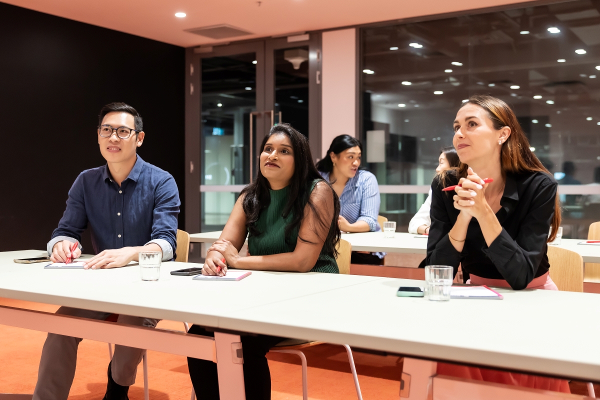 Men and women in meeting room at PHIVE
