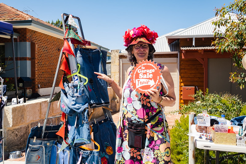 Woman standing in front of a garage sale