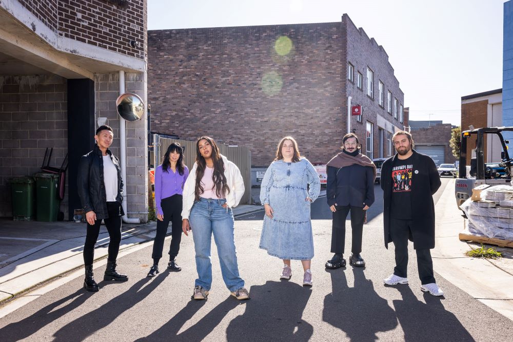 Women and Men standing in alley