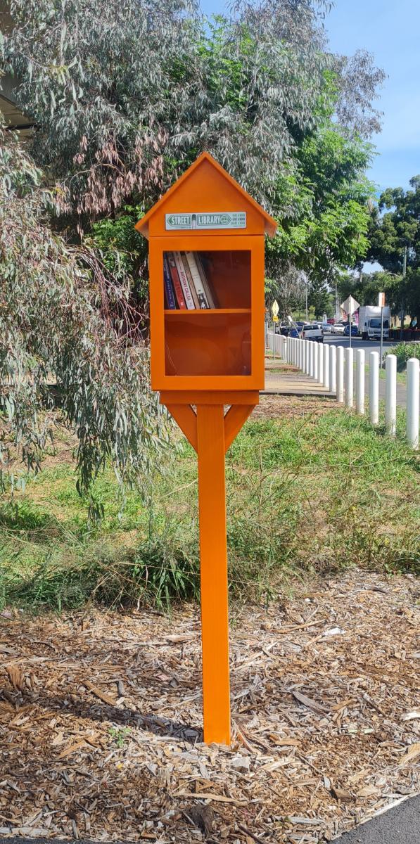 Orange painted Street Library box