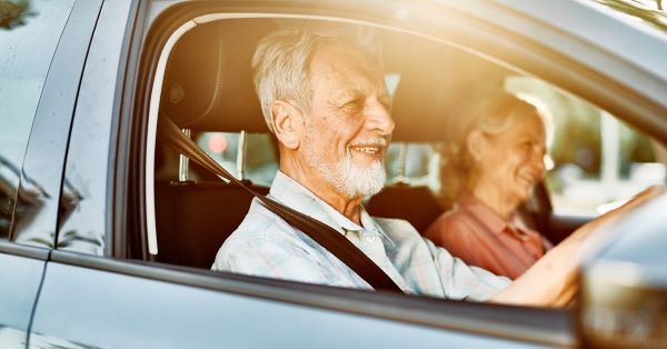 Man and woman driving in car