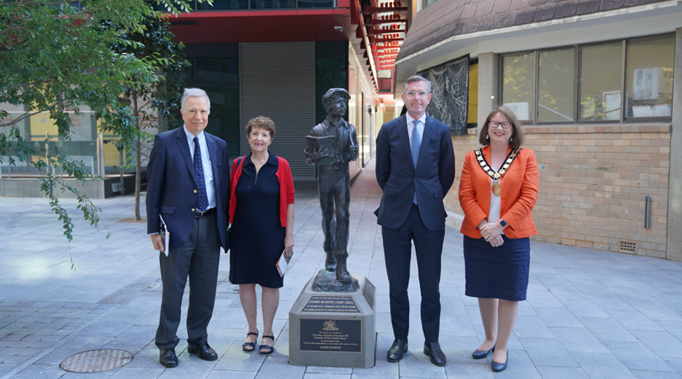 Dignitaries surround the unveiling of the statue of Sir James Martin in Parramatta Square
