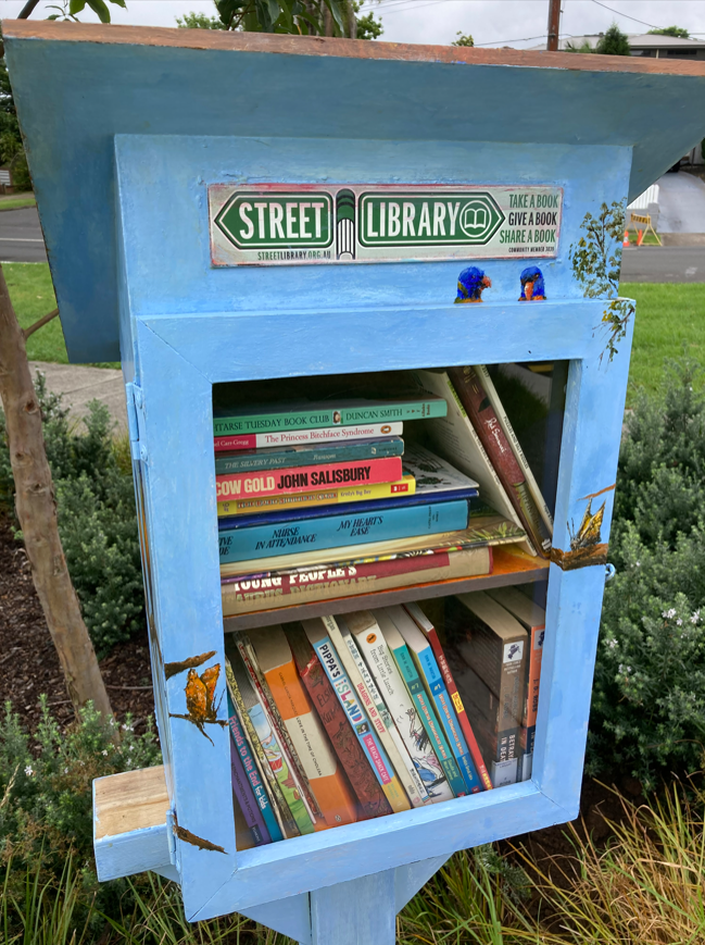 Books in a blue wooden box