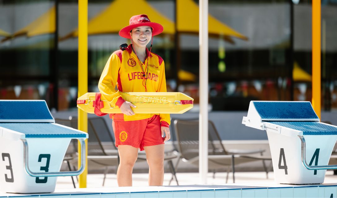 Lifeguard standing at the pool edge