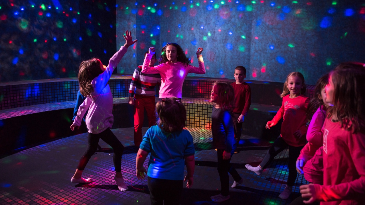 Children dancing in disco lights