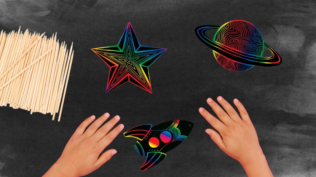 Hands on black tabletop with scratch artwork
