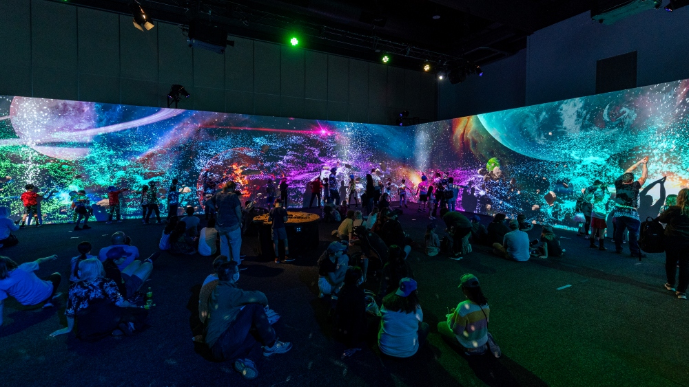 Children and adults experiencing Space Play by Box of Birds