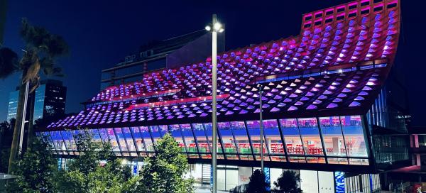 Phive Library with lights on at night