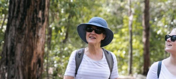 Two women walking in the bush