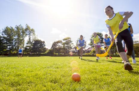 Kids playing field hockey
