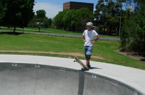 James Ruse Drive Skatepark with youngster waiting his turn to go down the half pipe