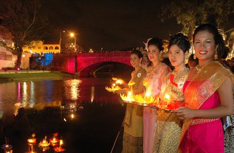 Loy Krathong presenters Loy Krathong presenters by the water
