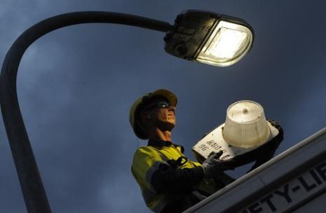 Man installing street light