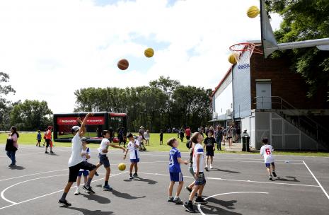Children shooting hoops at the West Epping Park Basketball Court