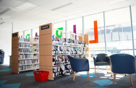 Ground floor of library looking up at racks of books