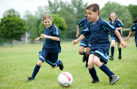 Children playing soccer.