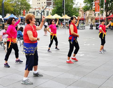 Over 55's enjoying belly-dancing in Parramatta Square