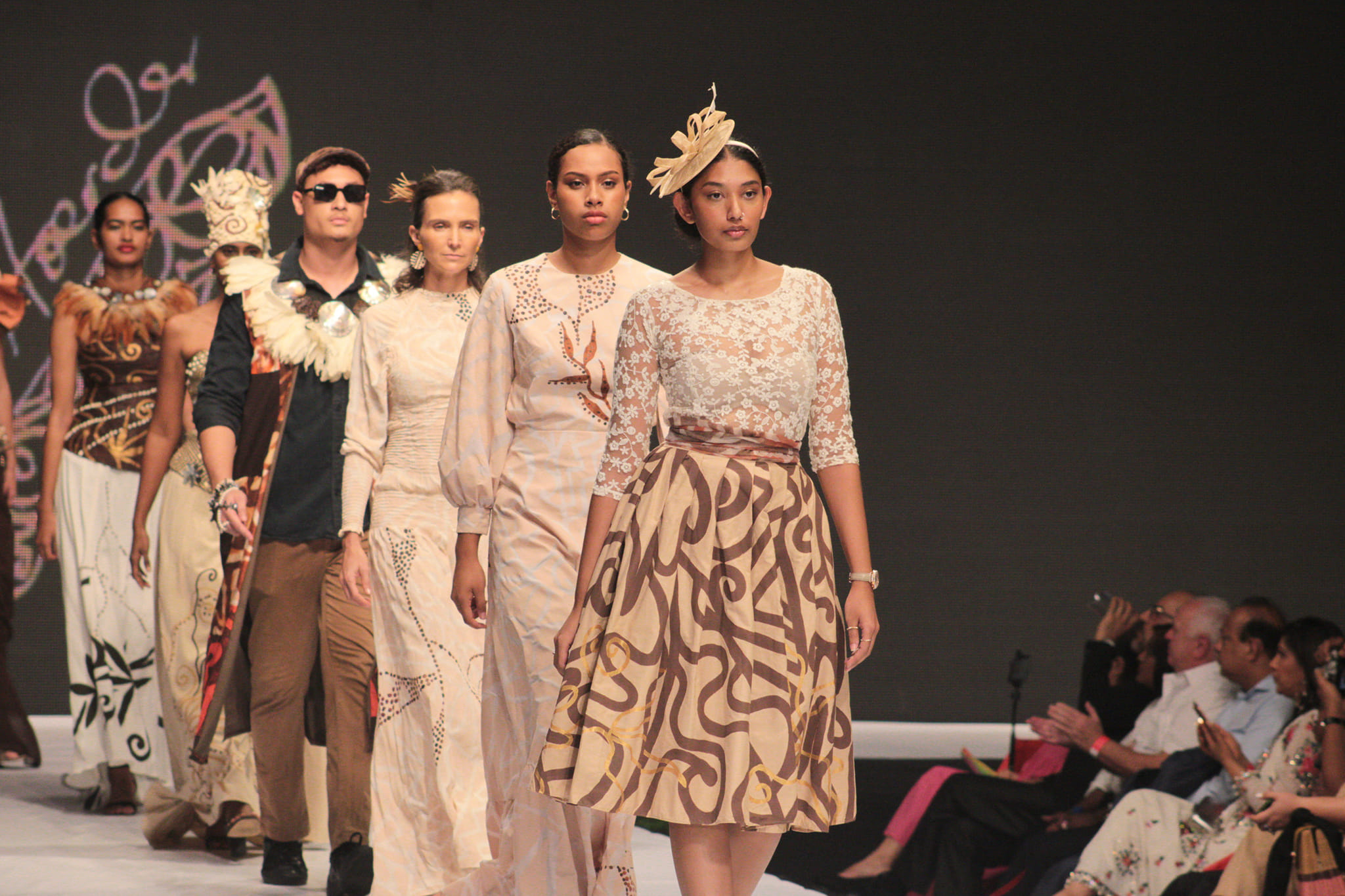 Models walking on fashion catwalk